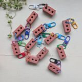 Pride is a Protest Keychain with Clasp