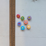 Plastic daisy buttons